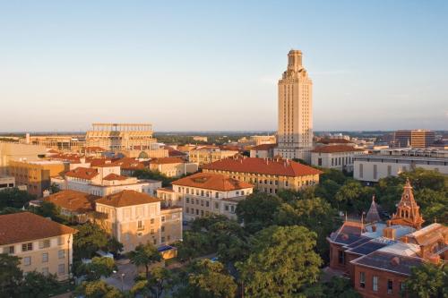 Aerial image the University of Texas campus and tower at sunset